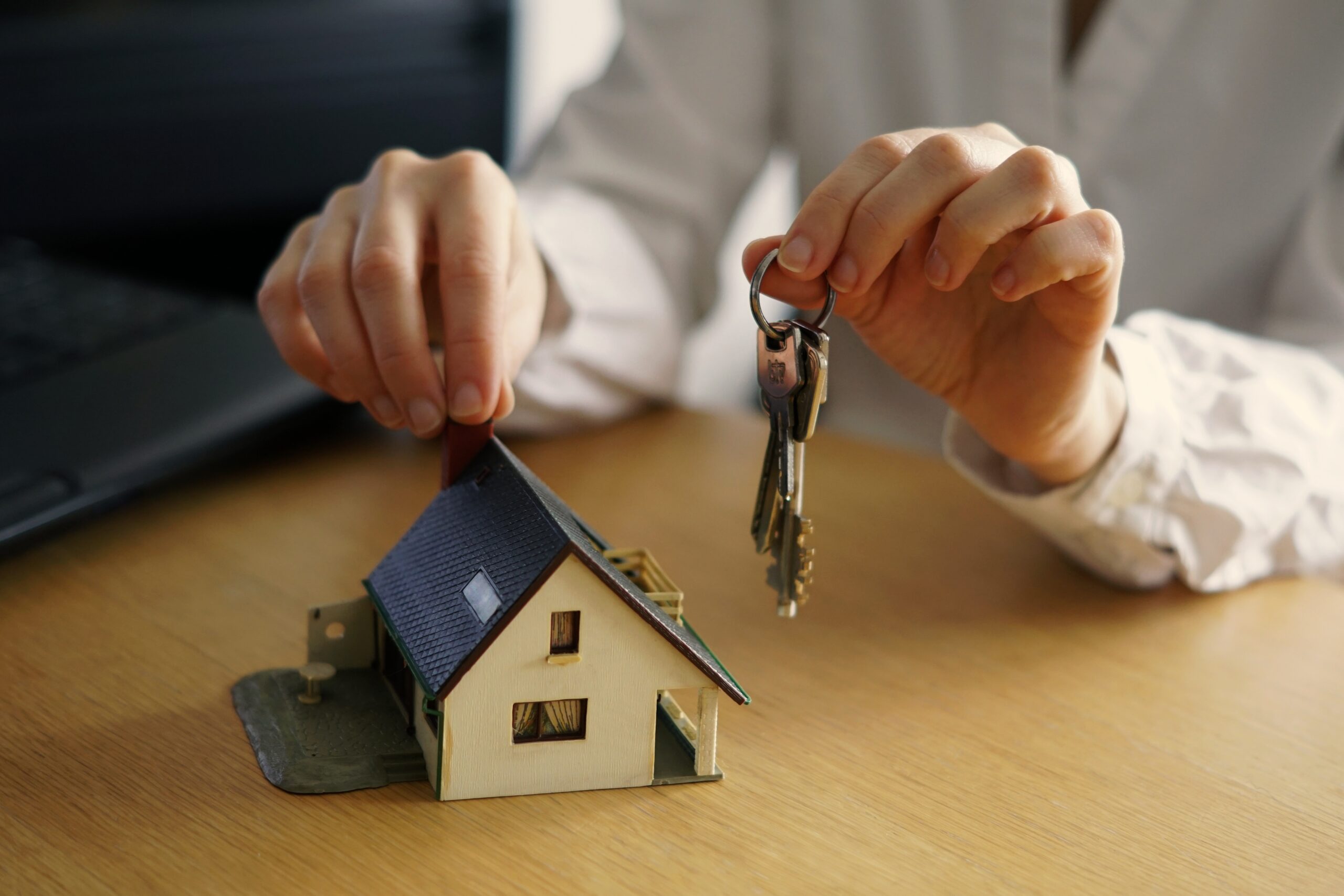 Closeup shot of a person thinking of buying or selling a house