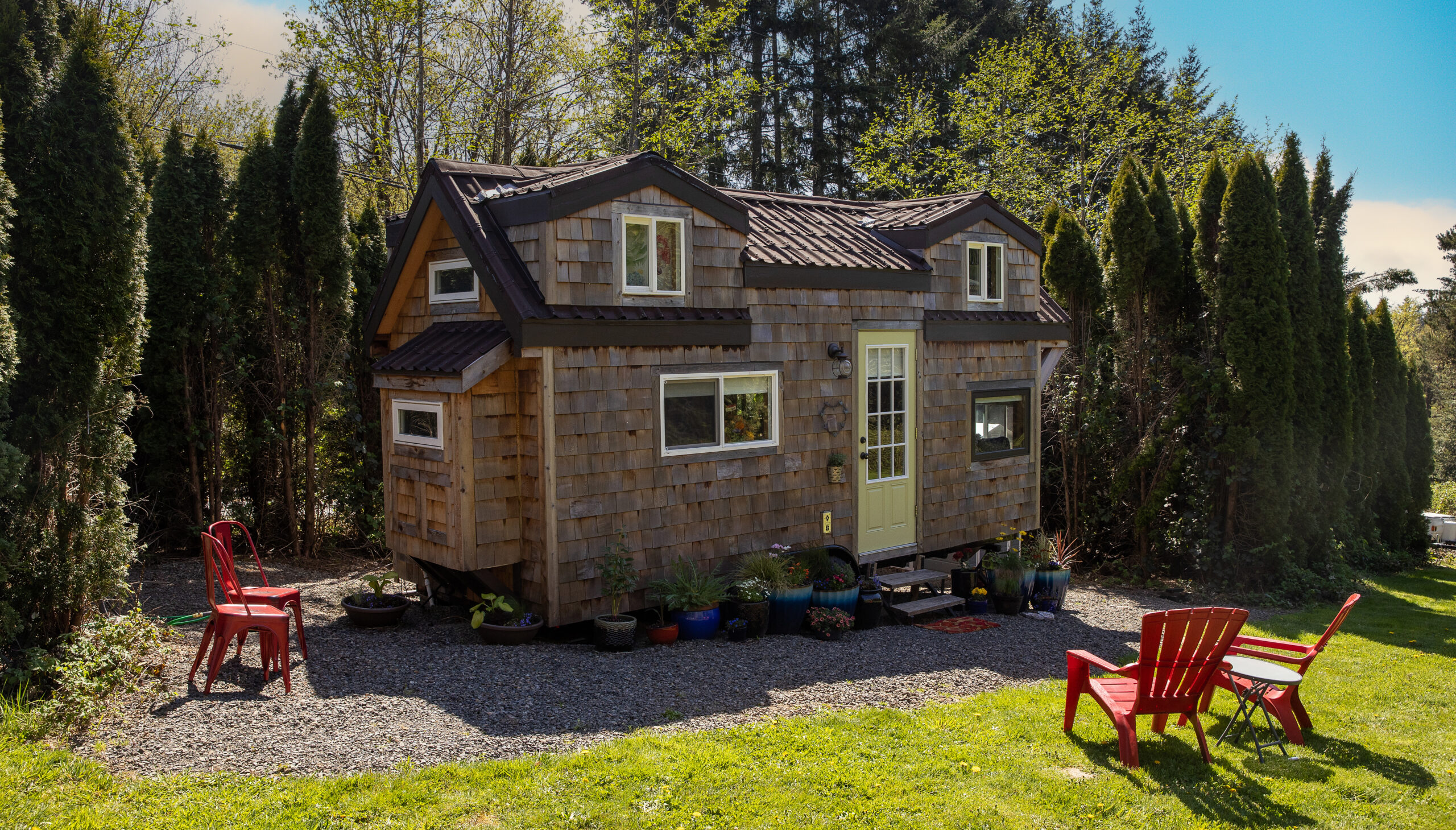Cute little tiny home with wood paneling and privacy for a minimalist living experience