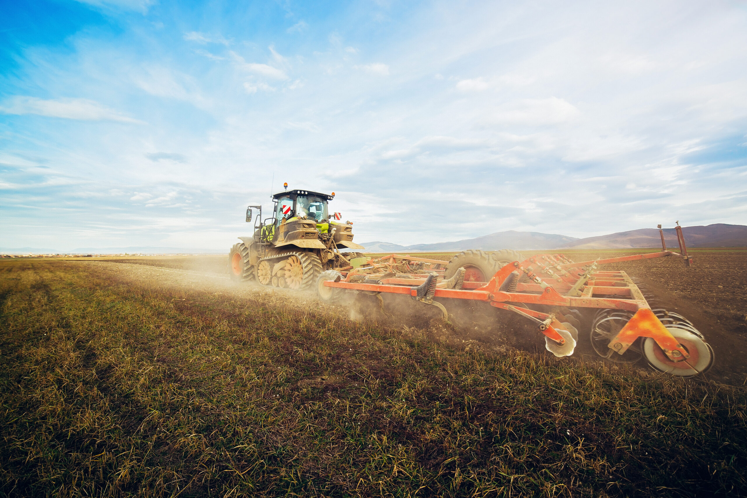 Tractor preparing the land for planting